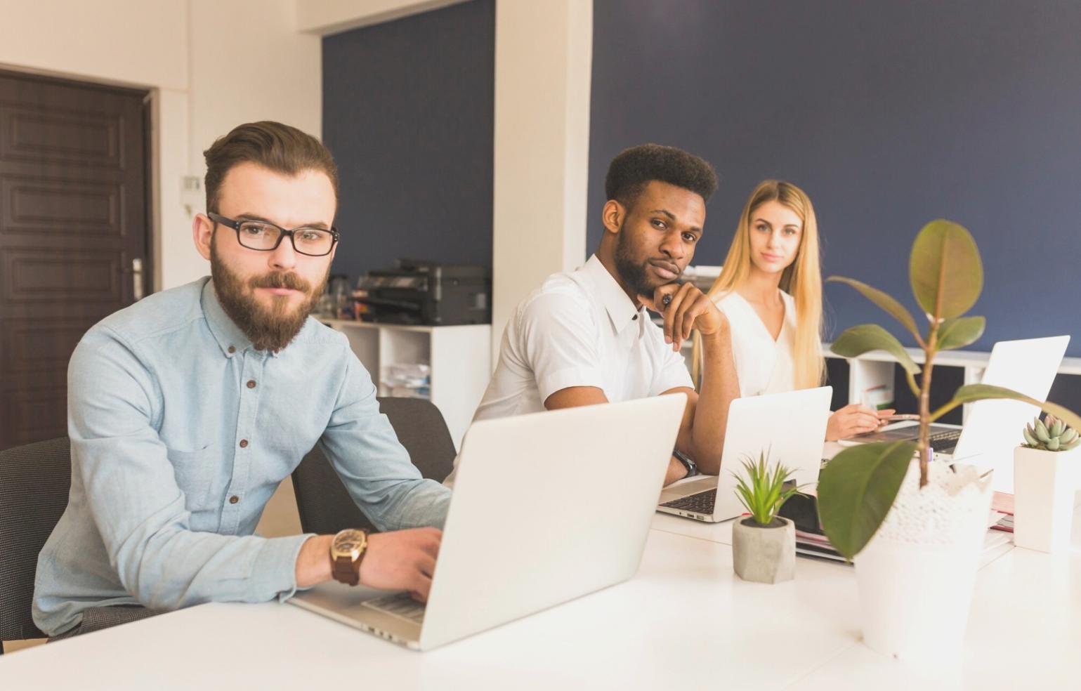 Students working on budget analysis with financial documents and calculators